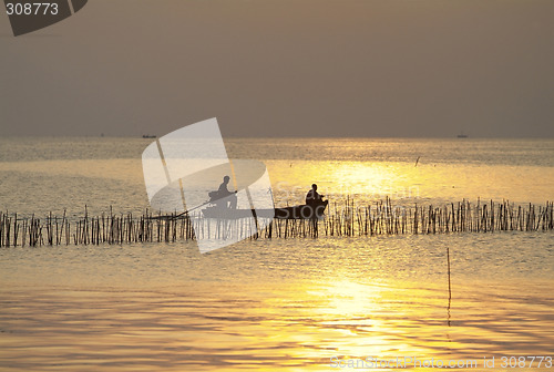 Image of Small boat before sunset