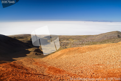 Image of Salar de Uyuni from colored mountains