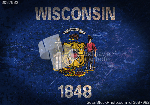 Image of Old rusty metal sign with a flag