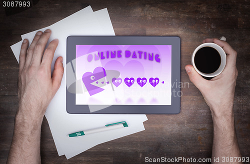 Image of Online dating on a tablet