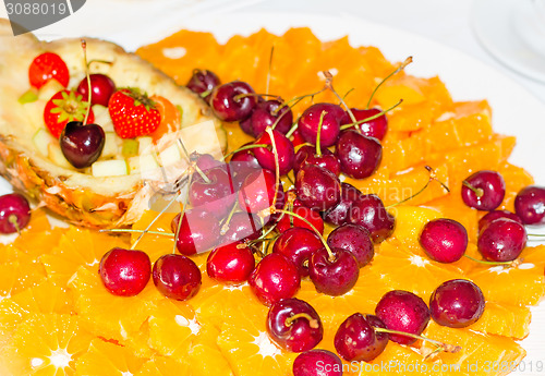 Image of Fruit dessert, diverse fruits and berries.