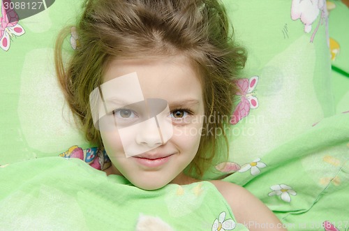 Image of Girl lying in bed