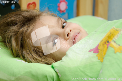 Image of The girl woke up in bed
