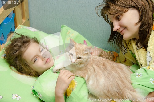 Image of Mom and daughter in the morning awake cat