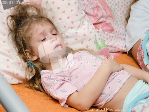Image of Diseased three year old girl suffering from high temperature
