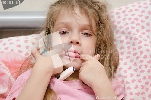 Image of Diseased three year old girl showing tongue