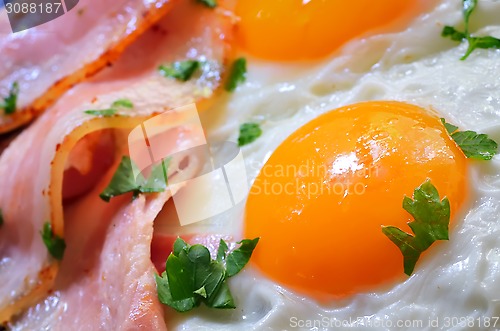 Image of breakfast with bacon and fried eggs