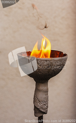 Image of Lamp with an open flame