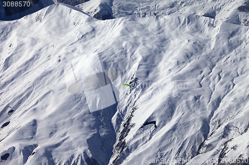 Image of Off-piste slope and paraglider in nice day