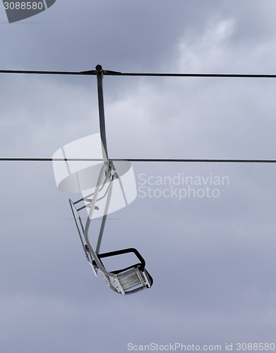 Image of Chair-lift and gray sky