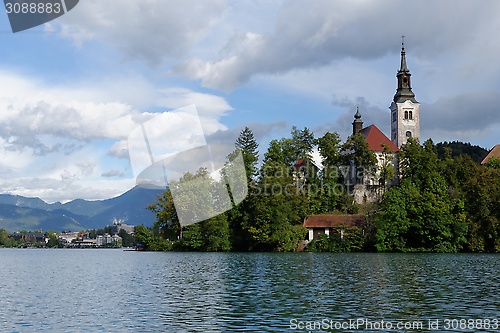 Image of Catholic church situated on an island on Bled lake, Slovenia