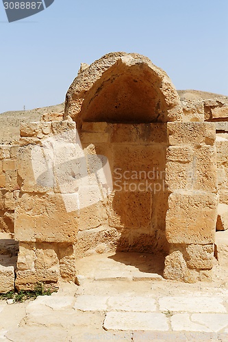 Image of Ancient stone wall with arched niche in Mamshit excavations in Israel