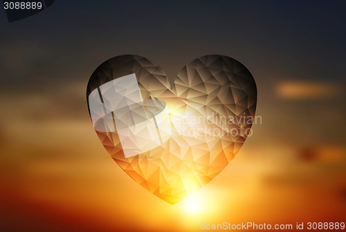 Image of Heart geometric shape on sunset sky