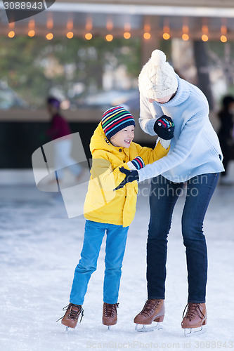 Image of family ice skating