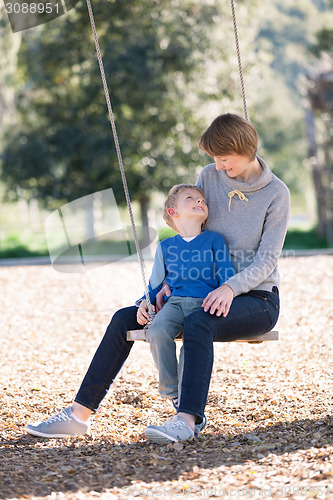 Image of family at swings