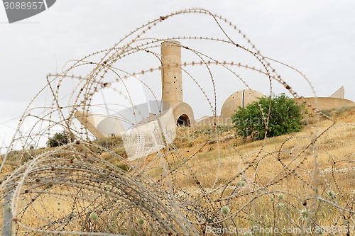 Image of Monument to the Negev Brigade in Beer Sheva, Israel, seen through the barbed wire