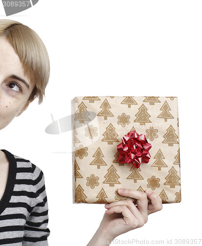 Image of Young woman holding a present