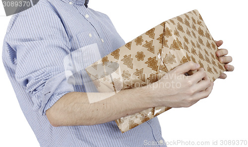 Image of Young man holding a present