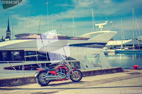 Image of Beautiful bike on the pier on the background of yachts. Cross pr