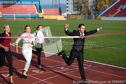 Image of business people running on racing track