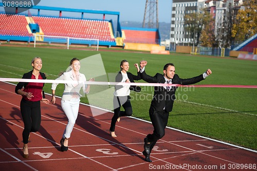 Image of business people running on racing track