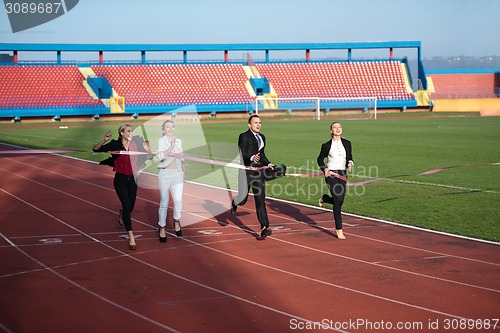 Image of business people running on racing track