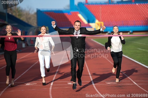 Image of business people running on racing track