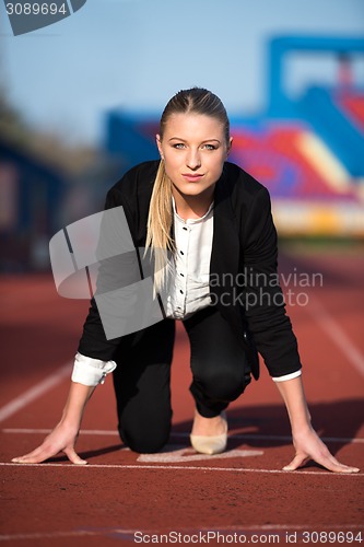 Image of business woman ready to sprint