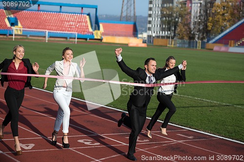 Image of business people running on racing track