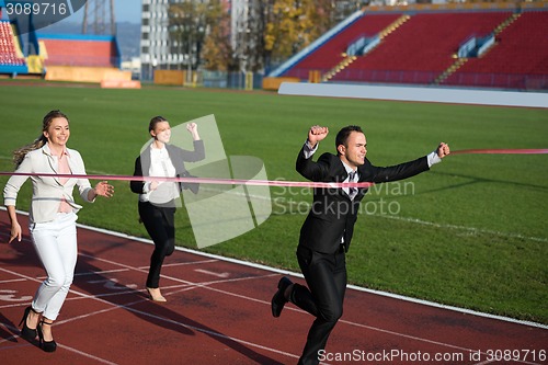 Image of business people running on racing track