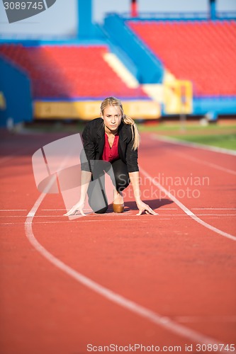 Image of business woman ready to sprint