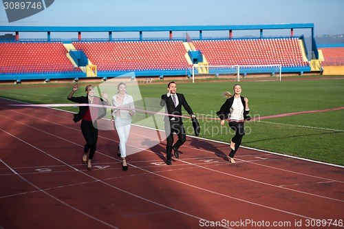 Image of business people running on racing track