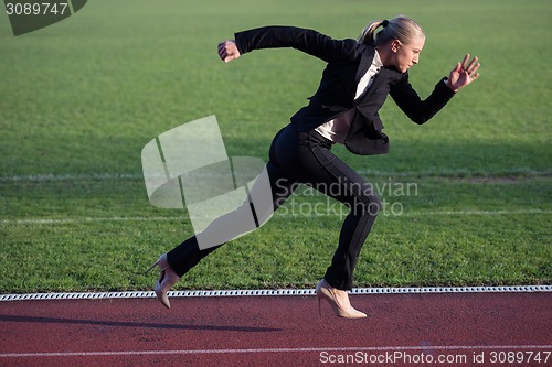 Image of business woman ready to sprint