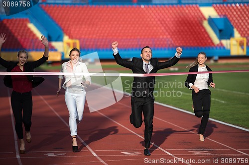 Image of business people running on racing track