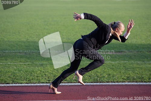 Image of business woman ready to sprint