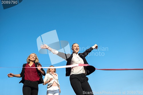 Image of business people running on racing track