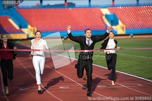 Image of business people running on racing track