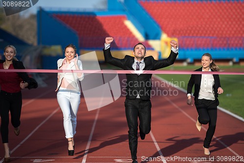 Image of business people running on racing track