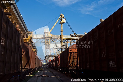 Image of Grain from silos being loaded onto cargo ship on conveyor belt