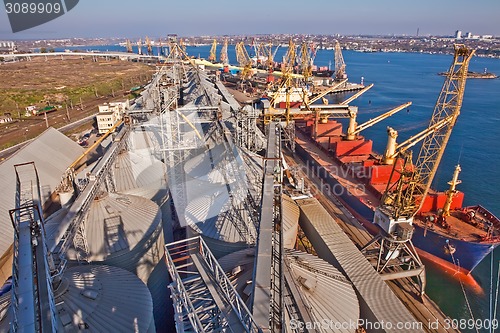 Image of Grain from silos being loaded onto cargo ship on conveyor belt