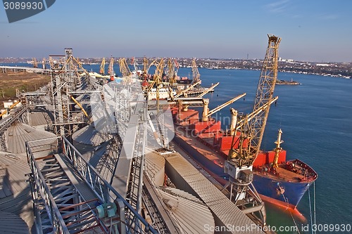 Image of Grain from silos being loaded onto cargo ship on conveyor belt