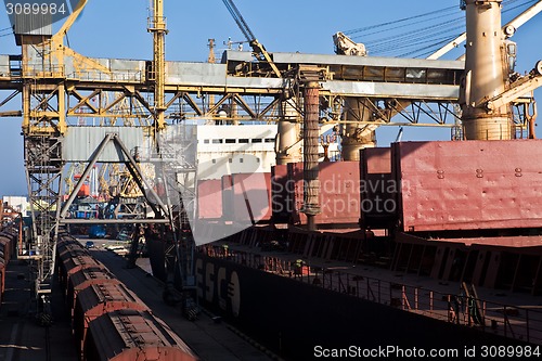 Image of Grain from silos being loaded onto cargo ship on conveyor belt