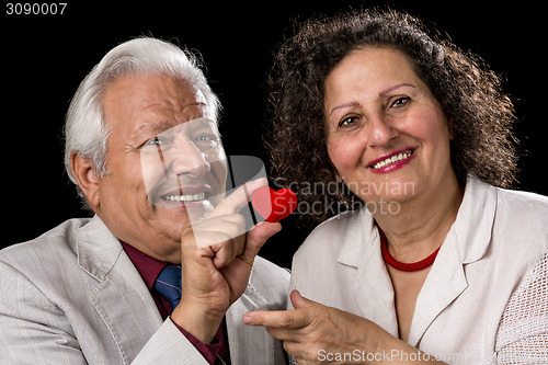 Image of Happy Senior Couple With A Red Valentine Heart
