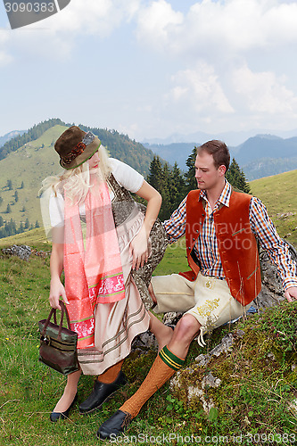 Image of Couple flirting in the Bavarian costumes