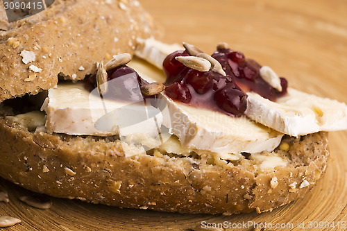 Image of bread served with camembert and cranberry