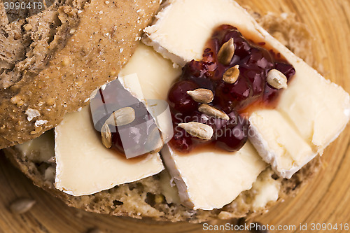 Image of bread served with camembert and cranberry