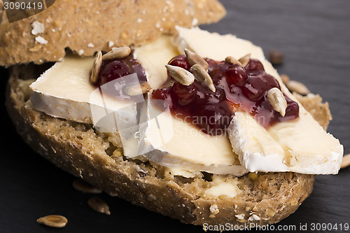 Image of bread served with camembert and cranberry