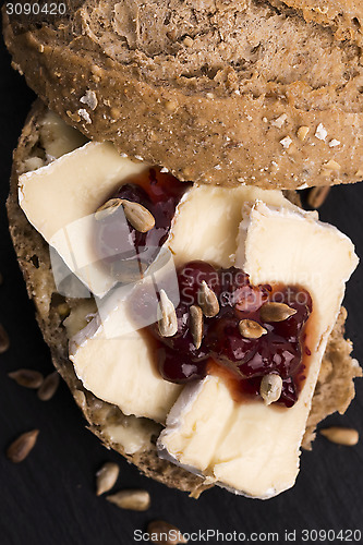 Image of bread served with camembert and cranberry