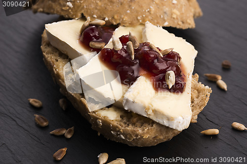 Image of bread served with camembert and cranberry