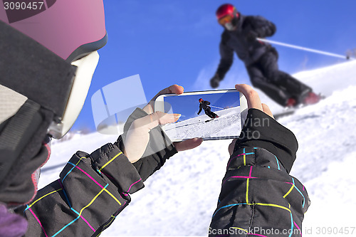 Image of Photographed skiers with mobile phone